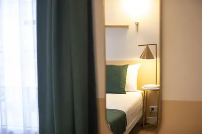 Un ou plusieurs lits dans un hébergement de l'établissement Grand Hôtel Saint-Aignan