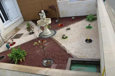 Jardin de l'établissement L'Escale Chambre chez l'habitant