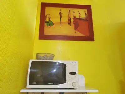 Télévision ou salle de divertissement dans l'établissement L'Escale Chambre chez l'habitant