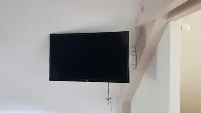 Télévision ou salle de divertissement dans l'établissement Chambres d hotes Couette et Campagne