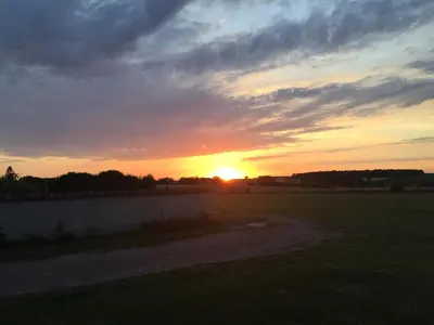 Lever ou coucher de soleil vu de la maison de vacances ou à proximité