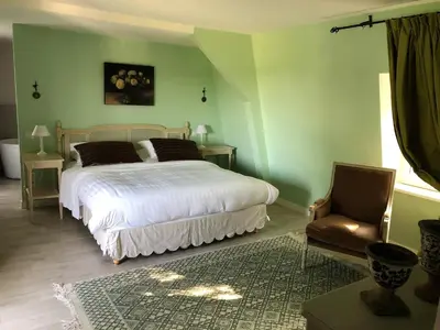 Un ou plusieurs lits dans un hébergement de l'établissement Cottage Jardin Duplex of 70 m for 2 people 1 bedroom 2 bathrooms