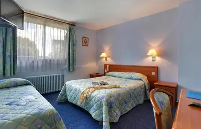 Un ou plusieurs lits dans un hébergement de l'établissement Contact Hôtel de France Contres-Beauval-Cheverny