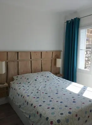 Un ou plusieurs lits dans un hébergement de l'établissement Appartement sur l’ile de Saumur