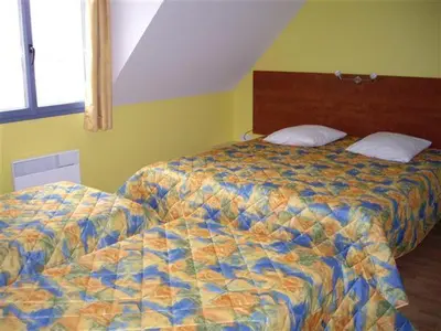 Un ou plusieurs lits dans un hébergement de l'établissement Domaine La Terrasse des Oliviers