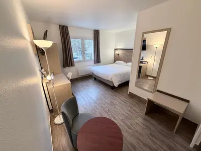 Un ou plusieurs lits dans un hébergement de l'établissement Hotel ARBOR - Les Hunaudieres - Le Mans Sud - Mulsanne