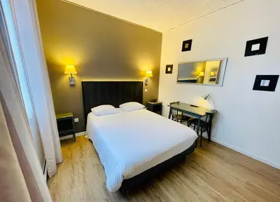Un ou plusieurs lits dans un hébergement de l'établissement Hotel Italia