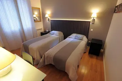 Un ou plusieurs lits dans un hébergement de l'établissement Hotel Italia