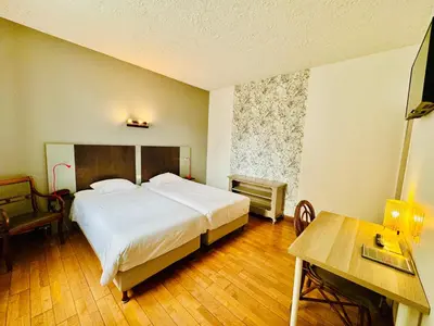 Un ou plusieurs lits dans un hébergement de l'établissement Hotel Italia