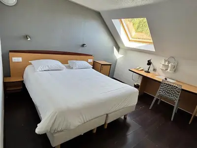Un ou plusieurs lits dans un hébergement de l'établissement Campanile Saumur