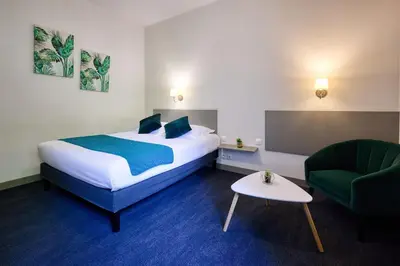 Un ou plusieurs lits dans un hébergement de l'établissement Hotel De La Pommeraie