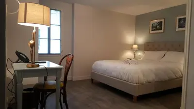 Un ou plusieurs lits dans un hébergement de l'établissement Hôtel Chez Jacqueline