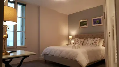 Un ou plusieurs lits dans un hébergement de l'établissement Hôtel Chez Jacqueline