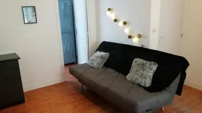 Coin salon dans l'établissement Appartement Taïko