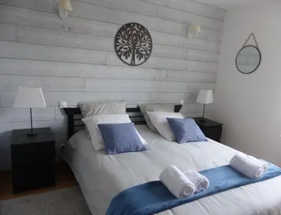Un ou plusieurs lits dans un hébergement de l'établissement La maison de Joëlle