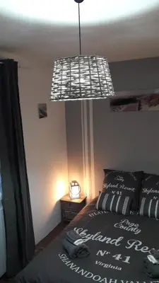Un ou plusieurs lits dans un hébergement de l'établissement chambre d'hôte - La ruche des Bleuets