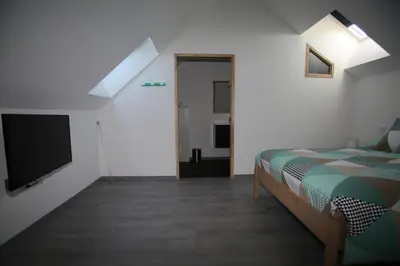 Un ou plusieurs lits dans un hébergement de l'établissement GITE MONTGOLFIÈRE 4 PERSONNES