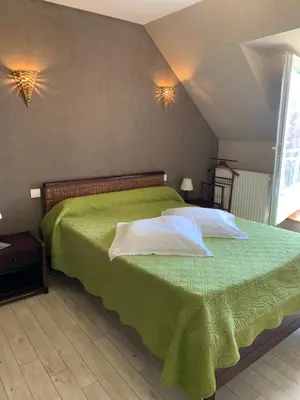 Un ou plusieurs lits dans un hébergement de l'établissement LES CHAMBRES D HOTES DU LAVOIR