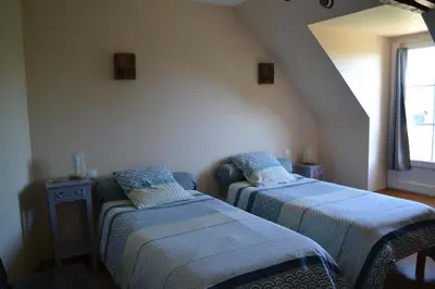 Un ou plusieurs lits dans un hébergement de l'établissement LES CHAMBRES D HOTES DU LAVOIR