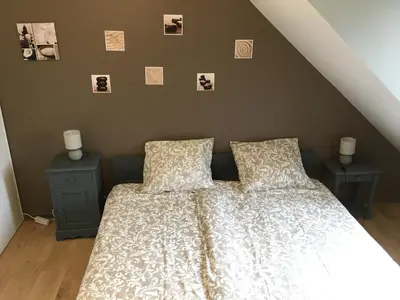 Un ou plusieurs lits dans un hébergement de l'établissement Chez Christophe et Cécile sur le circuit des 24 heures du Mans