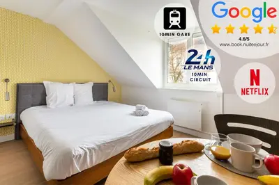 Un ou plusieurs lits dans un hébergement de l'établissement Appart Hotel NuitéeJour Le Mans Centre Jaurès
