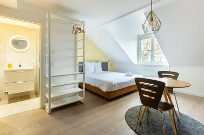 Un ou plusieurs lits dans un hébergement de l'établissement Appart Hotel NuitéeJour Le Mans Centre Jaurès