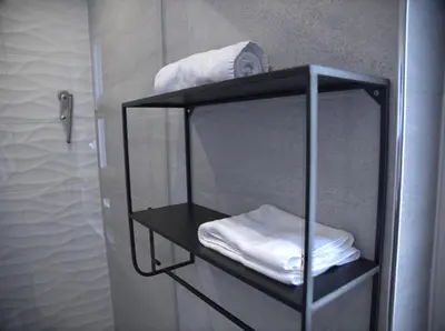 Un ou plusieurs lits dans un hébergement de l'établissement Appart Hotel NuitéeJour Le Mans Centre Jaurès