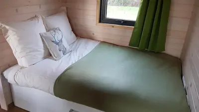 Un ou plusieurs lits dans un hébergement de l'établissement Le Domaine Des Anges, écolodge