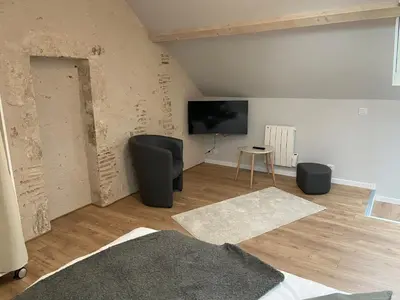 Télévision ou salle de divertissement dans l'établissement La vieille maison