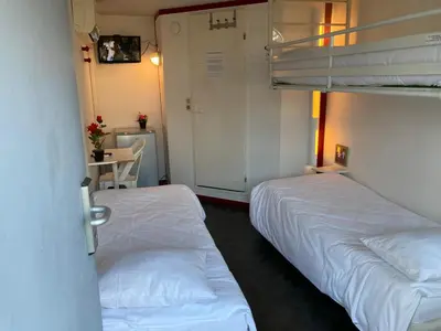 Un ou plusieurs lits dans un hébergement de l'établissement Nouvelle Classe Hotel