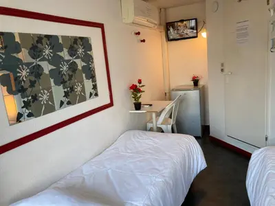 Un ou plusieurs lits dans un hébergement de l'établissement Nouvelle Classe Hotel