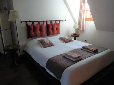 Un ou plusieurs lits dans un hébergement de l'établissement Chambre d'Hôtes Le Moulin des Landes