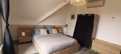 Un ou plusieurs lits dans un hébergement de l'établissement Le Clos de la Commanderie
