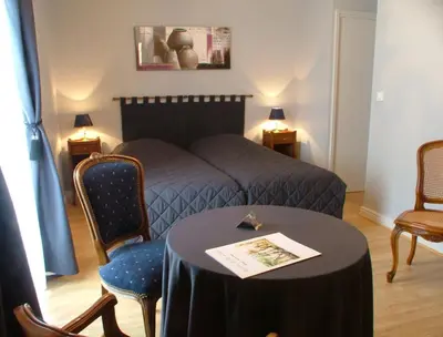 Coin salon dans l'établissement Hostellerie le Clos du Cher