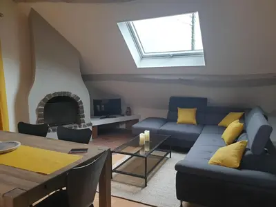 Coin salon dans l'établissement Grand appartement tout confort proche de CHAMBORD