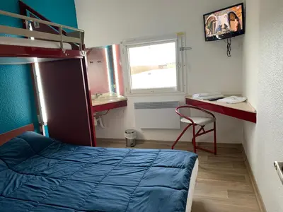 Un ou plusieurs lits dans un hébergement de l'établissement Hôtel Eco Blois -Sud- Vineuil