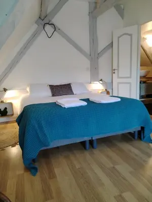 Un ou plusieurs lits dans un hébergement de l'établissement Appartement Henri II