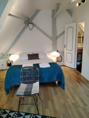 Un ou plusieurs lits dans un hébergement de l'établissement Appartement Henri II