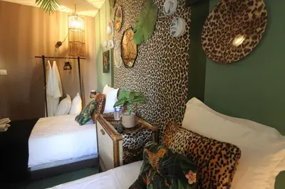 Un ou plusieurs lits dans un hébergement de l'établissement Taty Ginette Maison et Table d'Hôtes