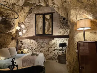 Un ou plusieurs lits dans un hébergement de l'établissement La Grotte du Moulin