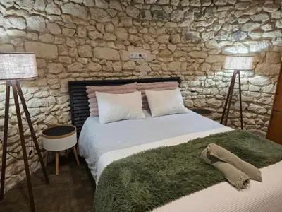 Un ou plusieurs lits dans un hébergement de l'établissement Le Moulin de la Motte Baudoin