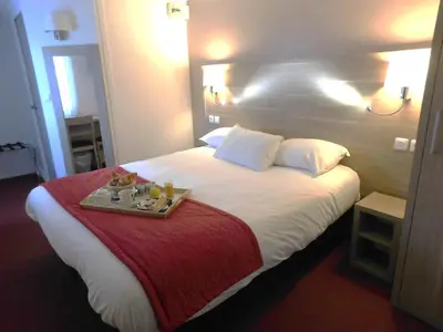 Un ou plusieurs lits dans un hébergement de l'établissement The Originals City, Hôtel Ambacia, Tours Sud