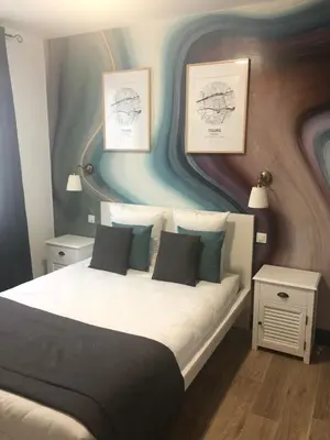 Un ou plusieurs lits dans un hébergement de l'établissement Hôtel Saint Eloi