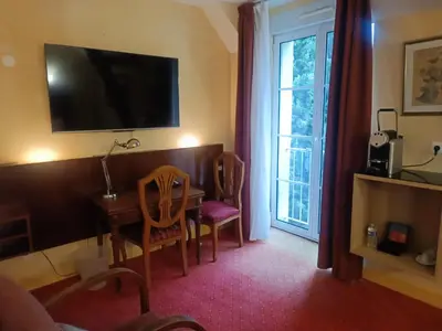 Télévision ou salle de divertissement dans l'établissement Hostellerie Les Hauts De Sainte Maure