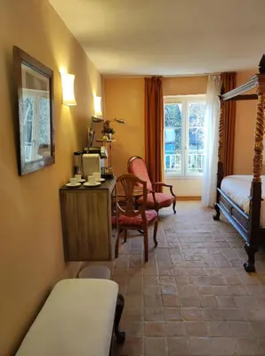 Un ou plusieurs lits dans un hébergement de l'établissement Hostellerie Les Hauts De Sainte Maure