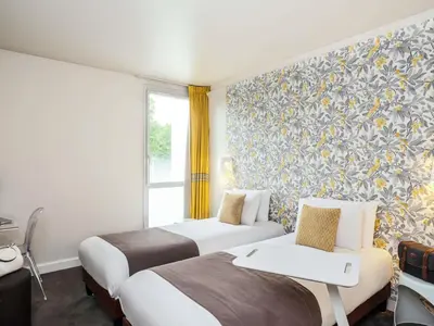 Un ou plusieurs lits dans un hébergement de l'établissement Mercure Le Mans Batignolles - Hotel & Spa