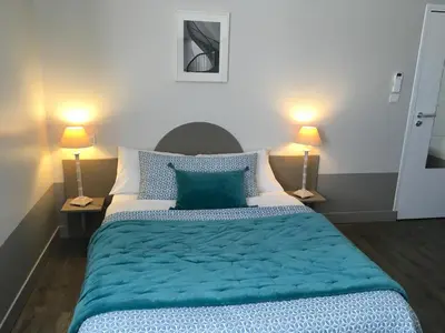 Un ou plusieurs lits dans un hébergement de l'établissement Hôtel L'Adresse