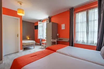 Un ou plusieurs lits dans un hébergement de l'établissement Hotel Val De Loire