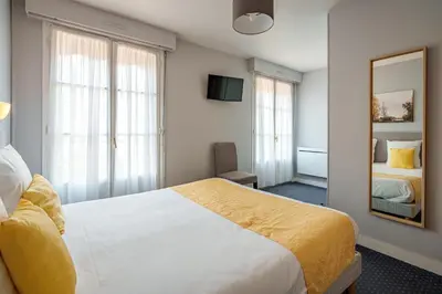 Un ou plusieurs lits dans un hébergement de l'établissement Hotel Val De Loire