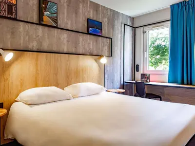 Un ou plusieurs lits dans un hébergement de l'établissement ibis Tours Sud